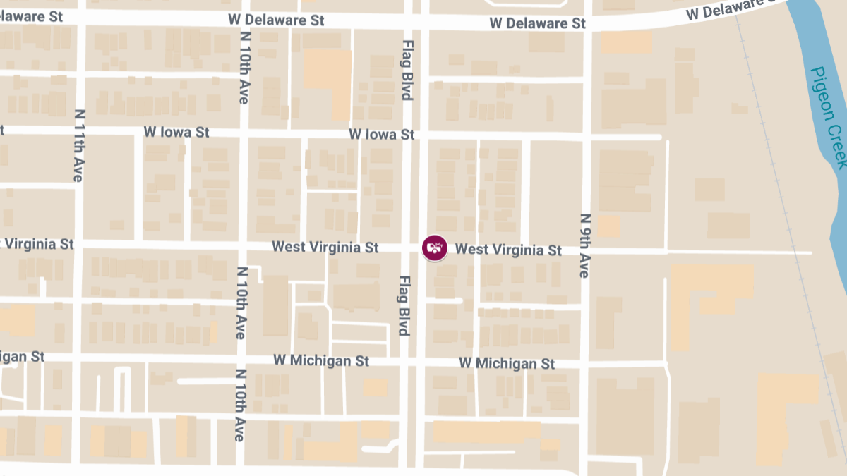 Rollover Crash on W Virginia St Involves Extrication and Vehicle Striking House