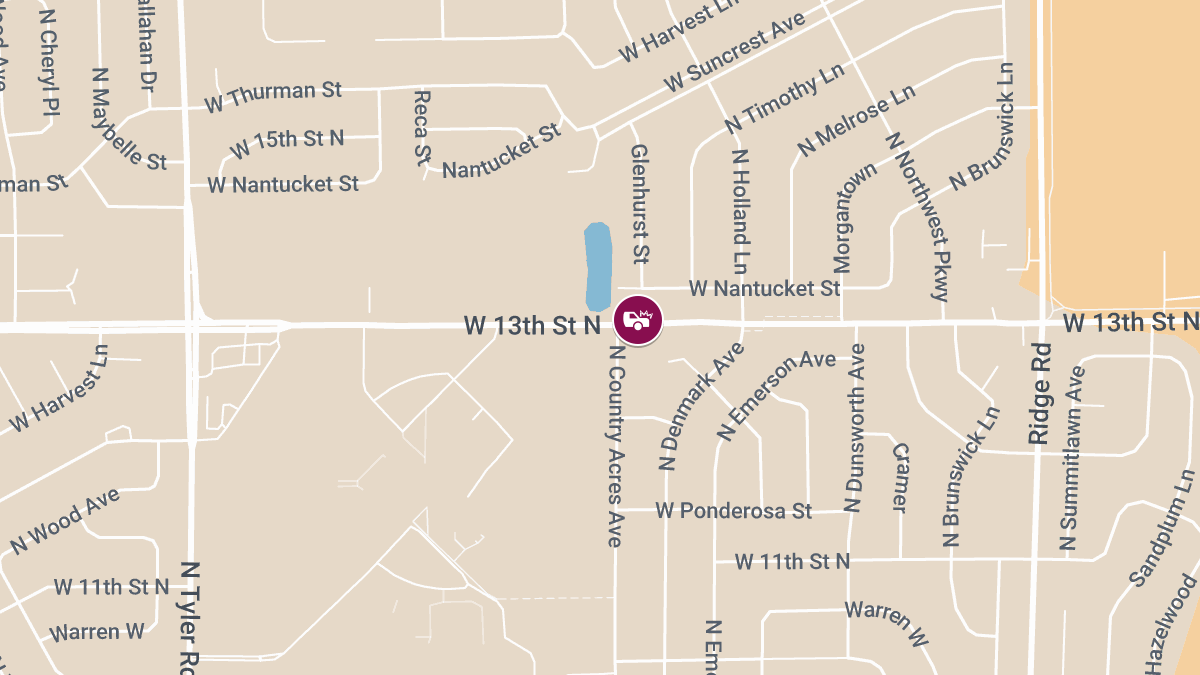 Three Injured in Crash on W 13th St N