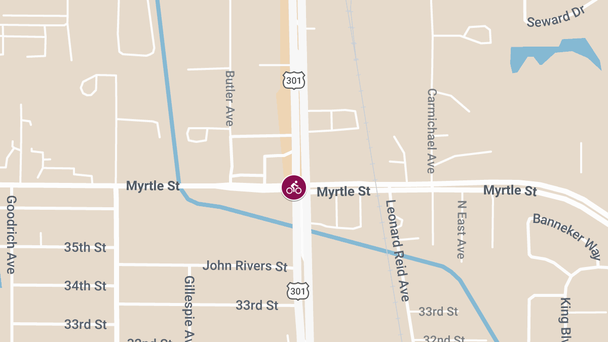 SUV and Bicyclist Involved in Injury Crash at N Washington Blvd & Myrtle St